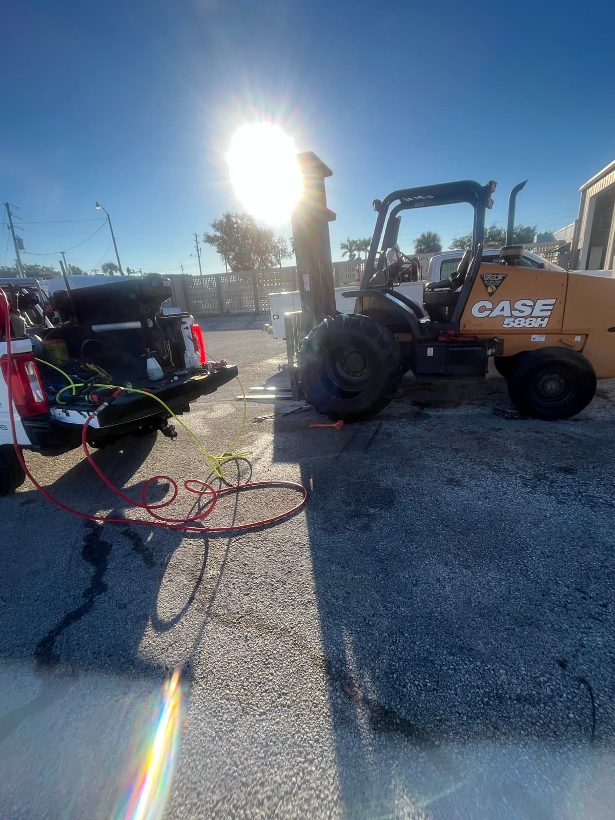 Case skid steer with K & W Mobile Tire Service on-site tire replacement — solid and pneumatic skid steer tires handled at construction yards and job sites across Central Florida