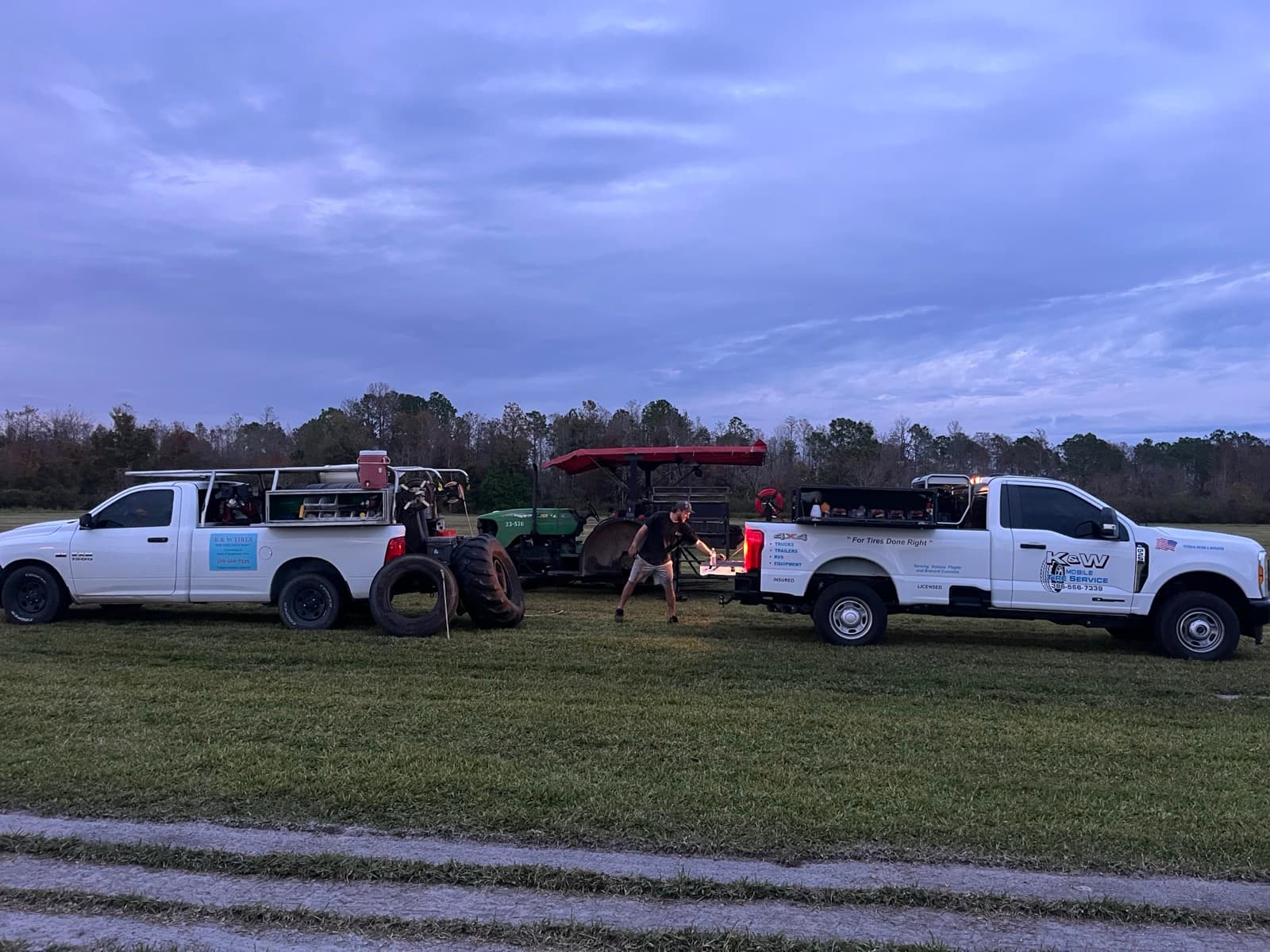 Farm tractor receiving on-site mobile tractor tire repair in Central Florida — K & W travels to farms, ranches, orchards, and nurseries across Volusia, Flagler, and Brevard Counties