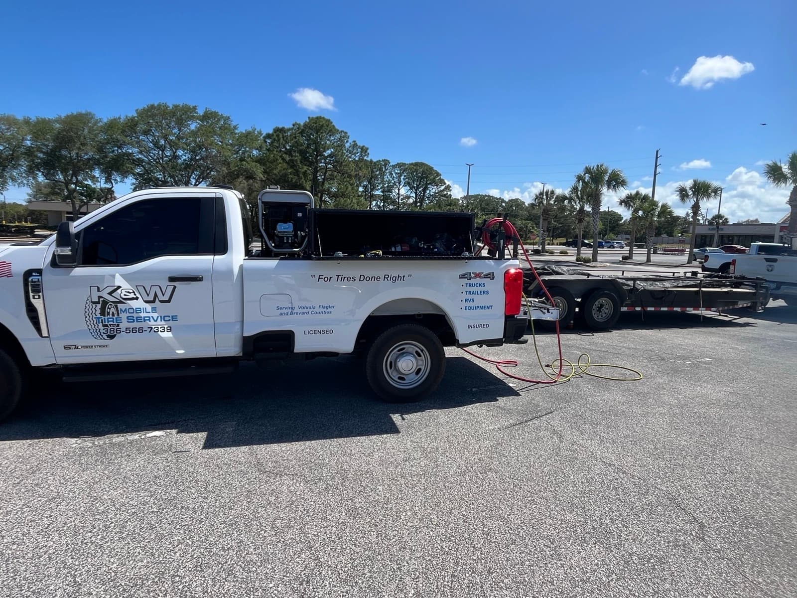 K & W Mobile Tire Service branded service truck — veteran-owned mobile tire company operating in Edgewater, Florida, servicing commercial trucks, trailers, RVs, and heavy equipment across Volusia, Flagler, and Brevard Counties