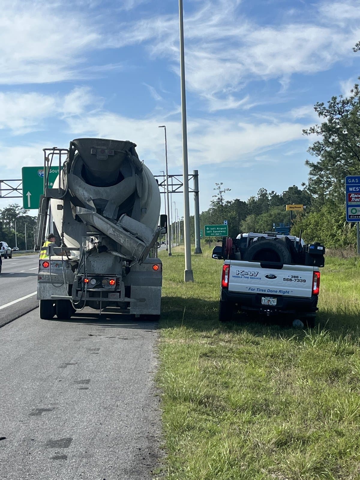 Roadside commercial truck tire repair on a Central Florida highway — K & W Mobile Tire Service responding to a cement mixer truck tire failure
