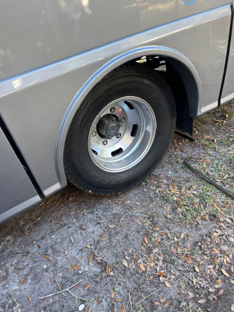 RV spare tire mount inspection — K & W checks DOT date codes and sidewall condition on RV spare tires during service calls in Central Florida